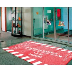ALFOMBRA PARA SUELO DE PASO NOVUS MANTEN DISTANCIA DE 1,5 M GRACIAS FONDO ROJO 85X150 CM