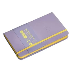 CUADERNO CON GOMILLA ANTARTIK NOTES TAPA DURA A6 HOJAS CUADRICULA MORADO Y AMARILLO 100 HOJAS 80 GR FSC