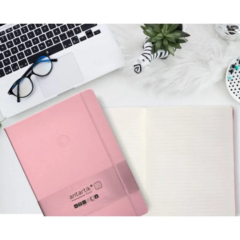 CUADERNO CON GOMILLA ANTARTIK NOTES TAPA DURA A4 HOJAS RAYAS ROSA PASTEL 100 HOJAS 80 GR FSC