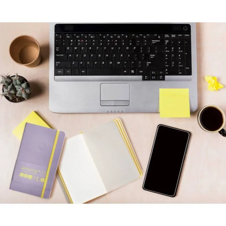 CUADERNO CON GOMILLA ANTARTIK NOTES TAPA BLANDA A6 CUADRICULA MORADO Y AMARILLO 100 HOJAS 80 GR FSC